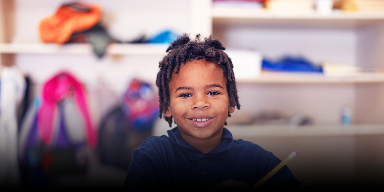 Student smiling in a classroom